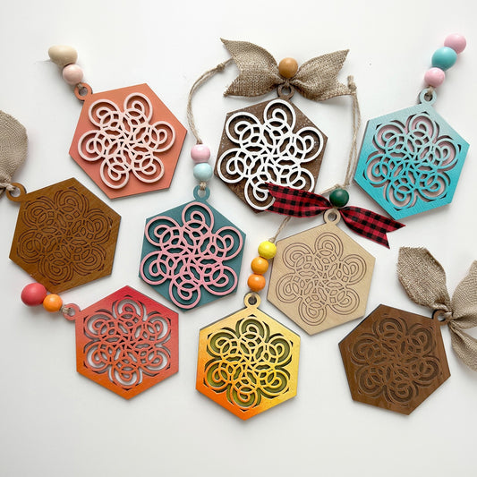 Colorful geometric wooden ornaments on a white background