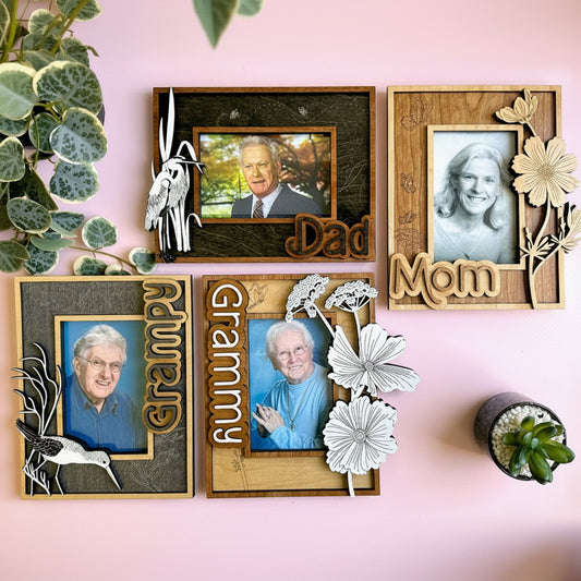 Set of family photo frames with 'Dad', 'Mom', 'Grandpa', and 'Grandma' text on a pink background.