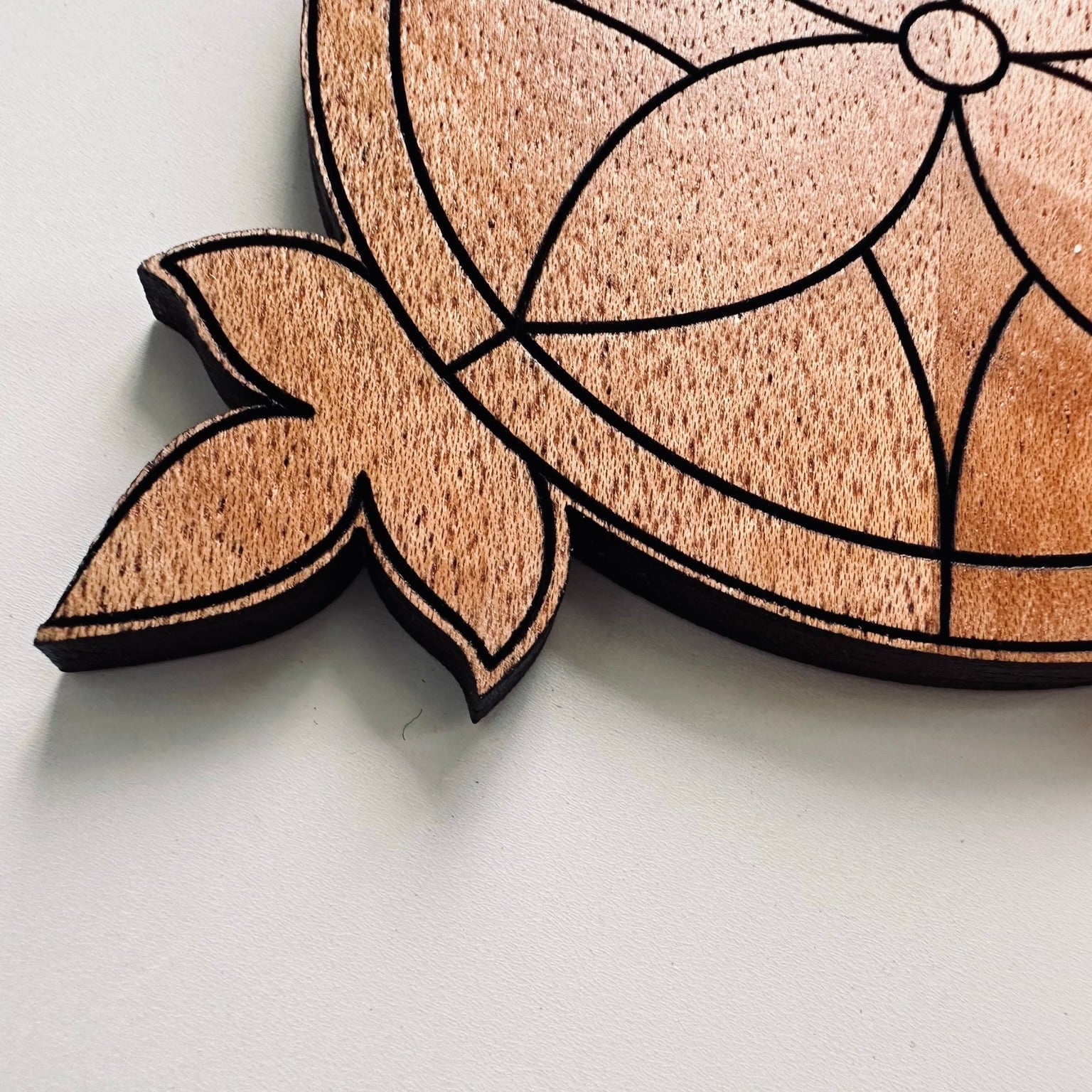 Wooden coaster on a light gray background