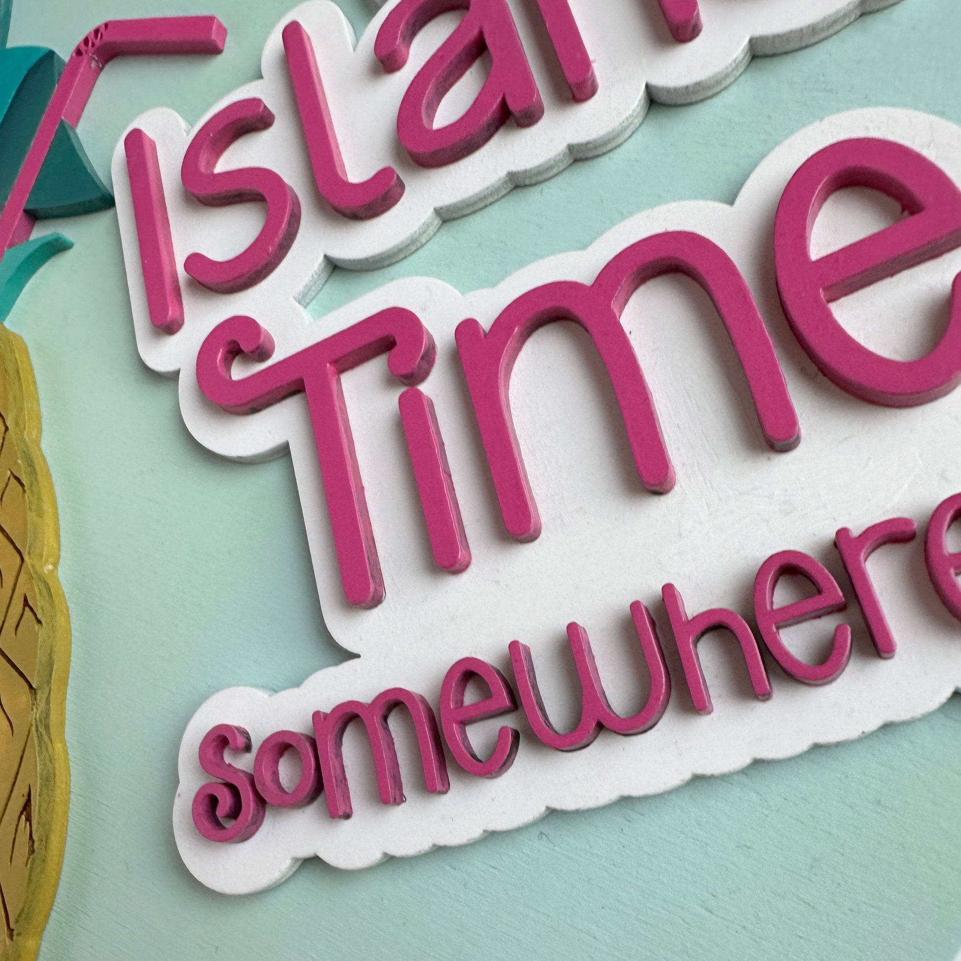Decorative sign with 'Island Time somewhere' text on a light blue background