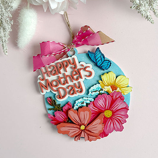 Decorative 'Happy Mother's Day' tag with colorful flowers on a light pink background