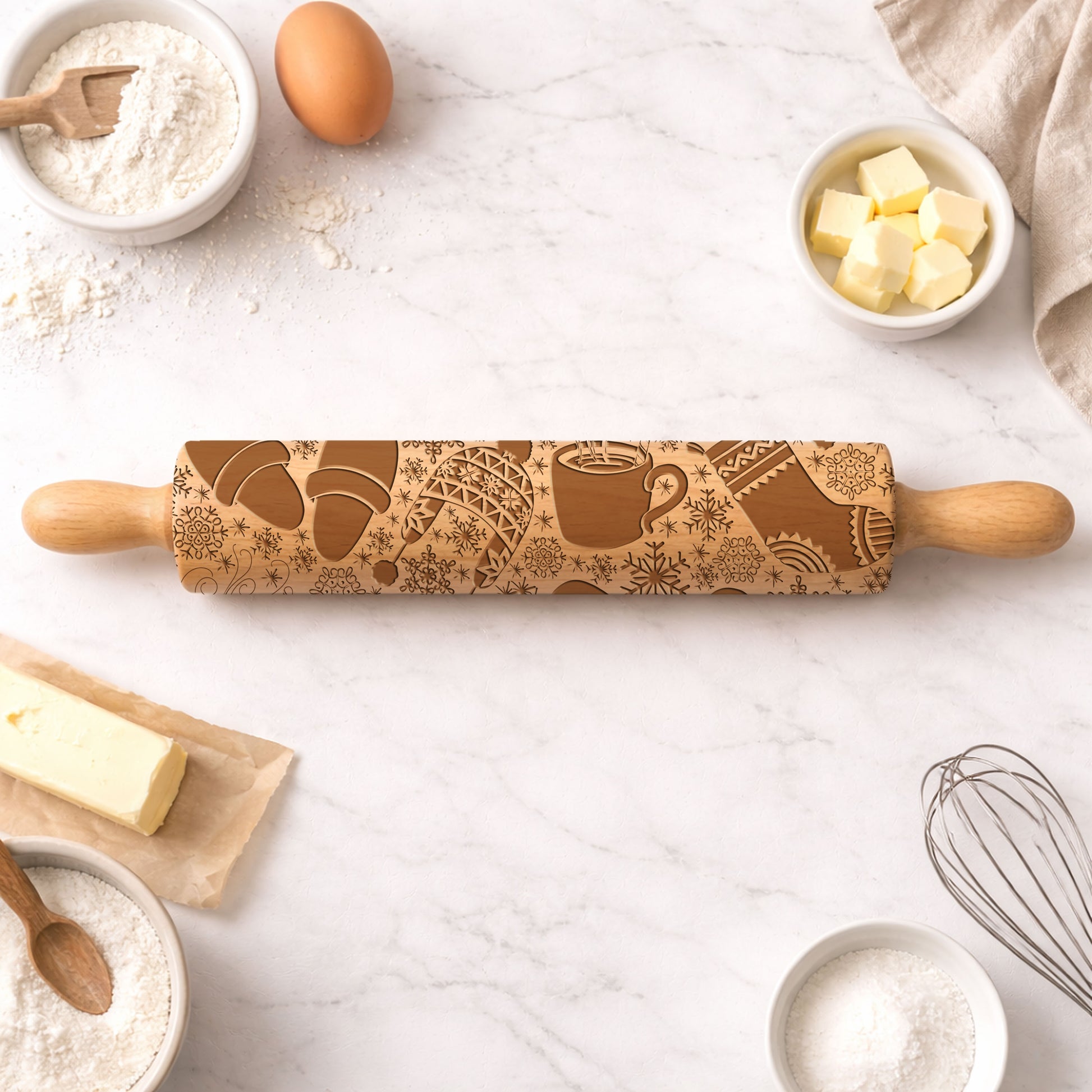 Wooden rolling pin with embossed designs on a kitchen counter with baking ingredients.