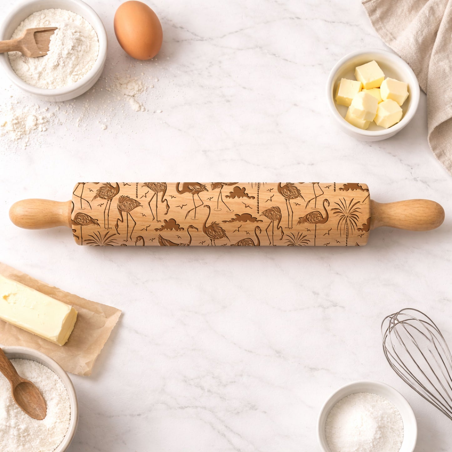 Wooden embossing rolling pin on a kitchen counter with baking ingredients.