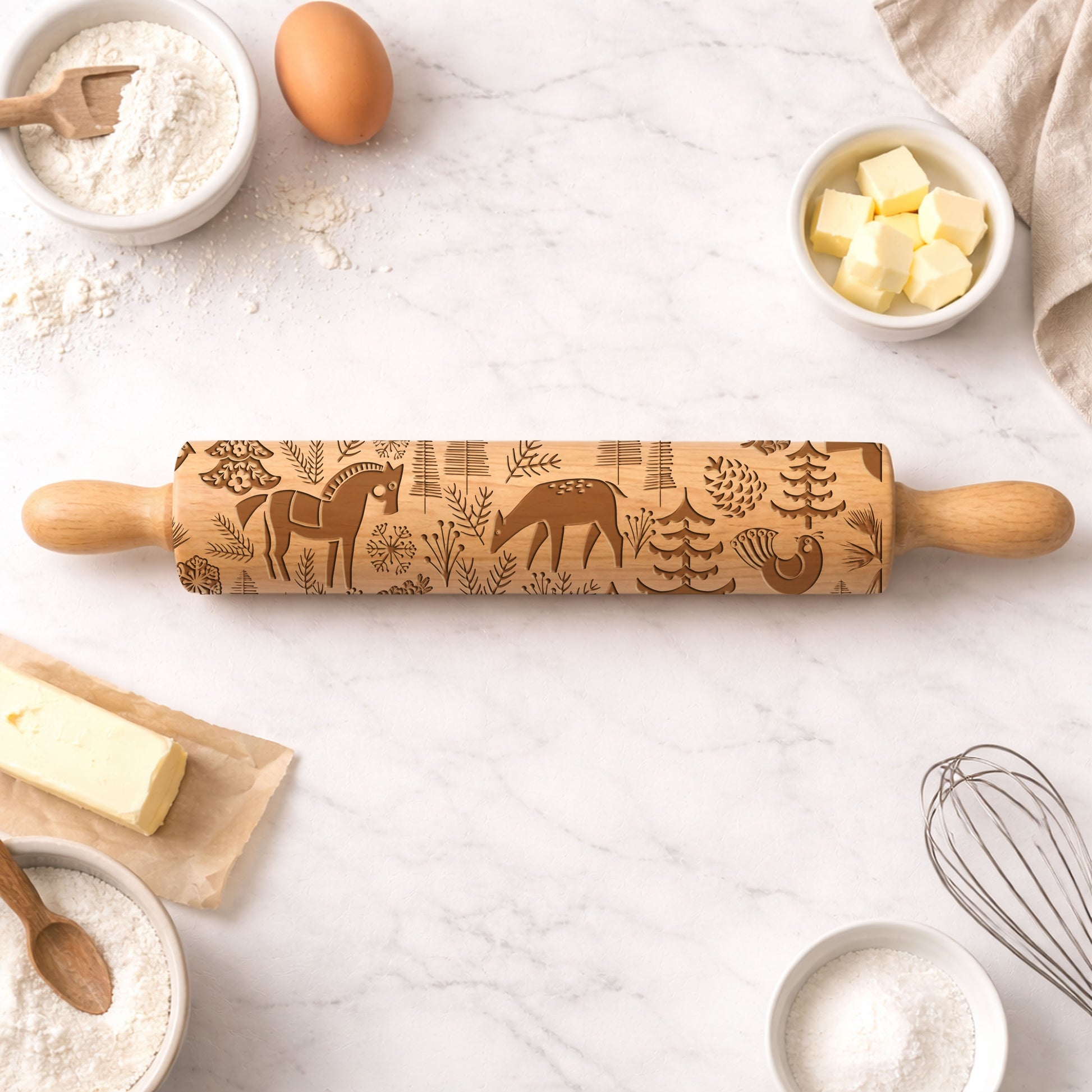 Wooden rolling pin with embossed designs on a kitchen counter with baking ingredients.