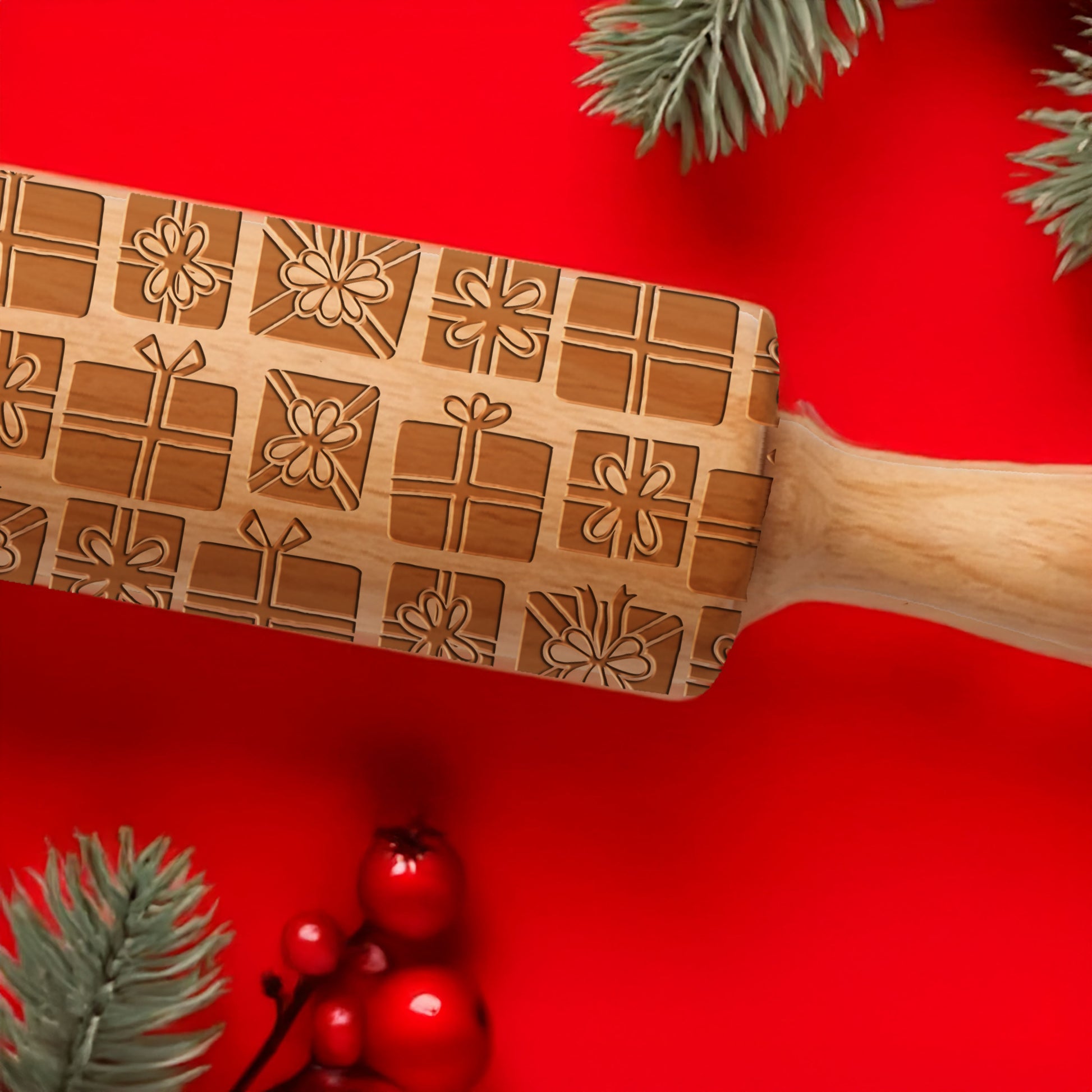 Wooden rolling pin with Christmas patterns on a red background