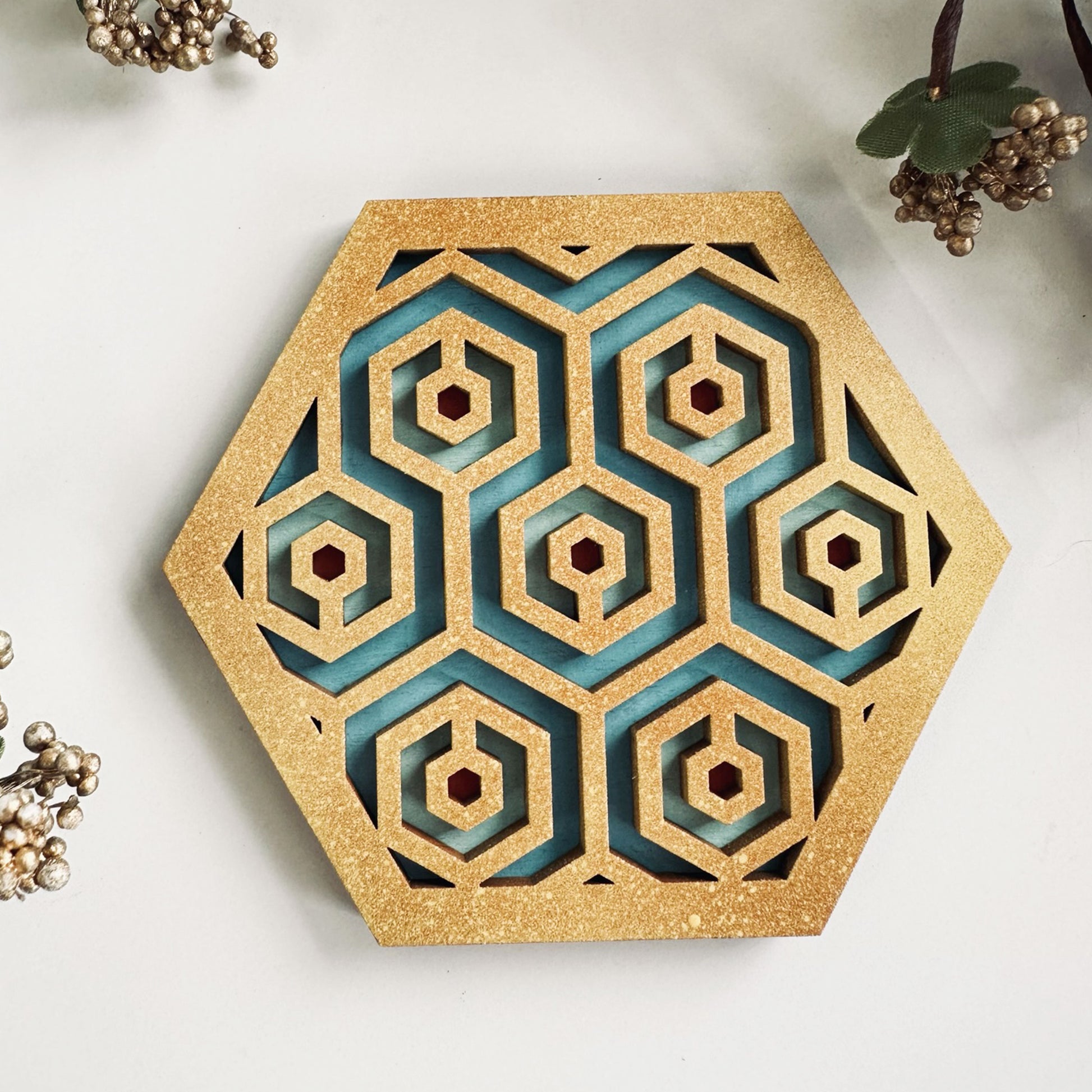 Decorative hexagonal wall art with geometric pattern on a light background