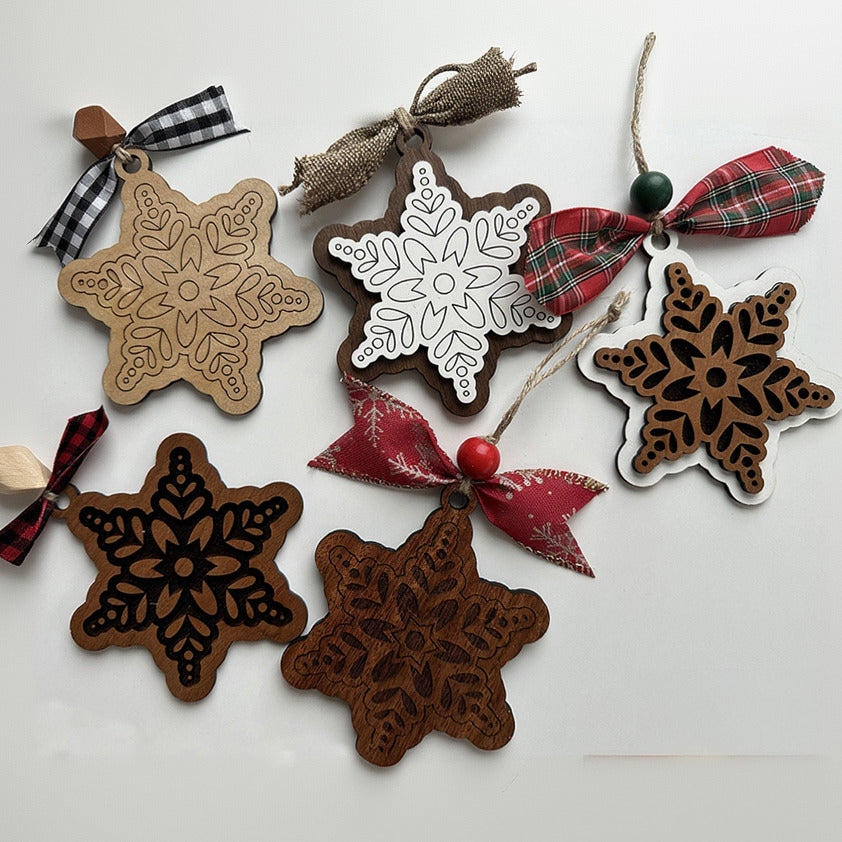Decorative star-shaped ornaments with snowflake patterns on a white background