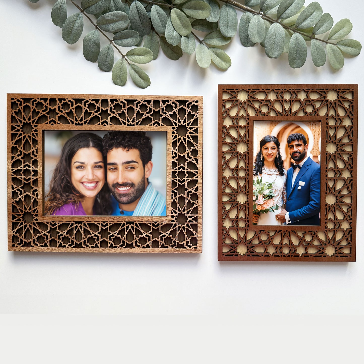 Two wooden photo frames with cut-out designs, each containing a couple's portrait.