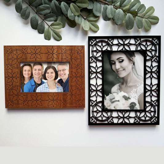 Two decorative picture frames with family and wedding photos on a white background.